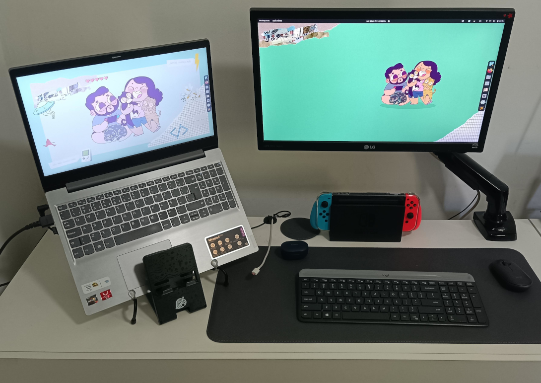 Imagem da minha mesa com meu notebook, monitor, teclado e mouse, além de um Nintendo Switch